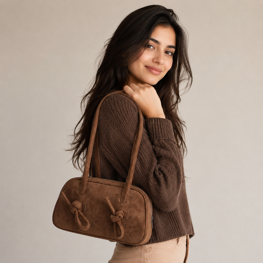 Woman carrying vintage suede shoulder purse