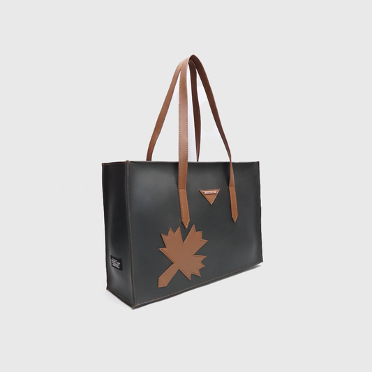 black tote bag with brown handles leaf design