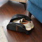 Black breathable shoe storage bag with mesh panels and zipper closure holding casual shoes, ideal for travel, gym, and dust-free organization.