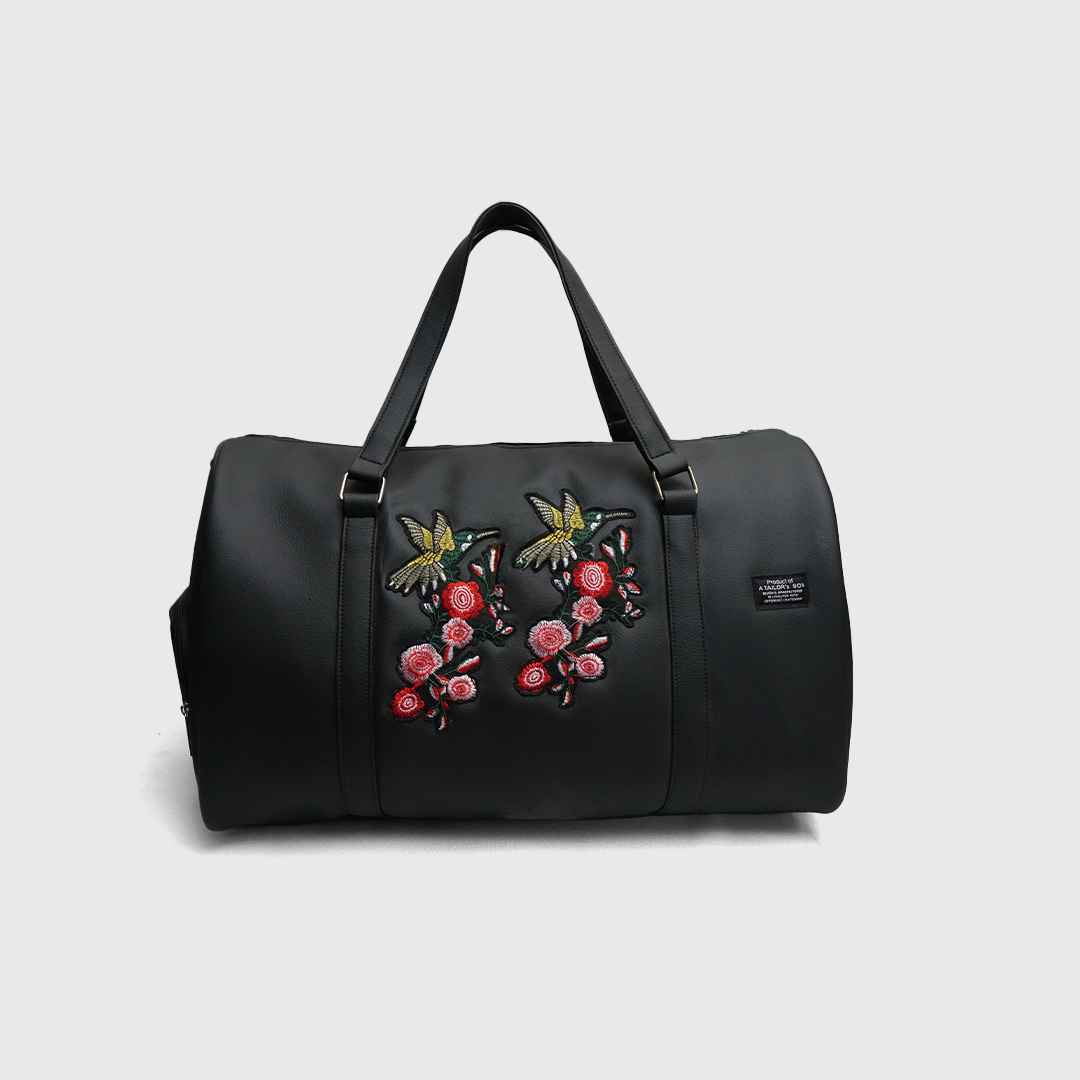 Black duffle bag with hummingbird embroidery
