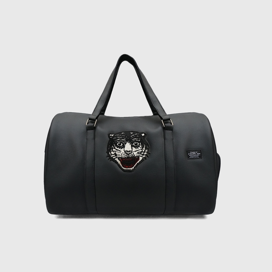Black synthetic leather duffle bag with embroidered tiger patch by A Tailor Son