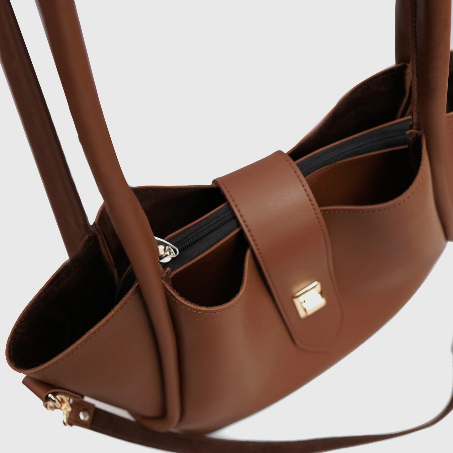 Close-up of SIENNA tote bag with premium lock detail and inner pouch