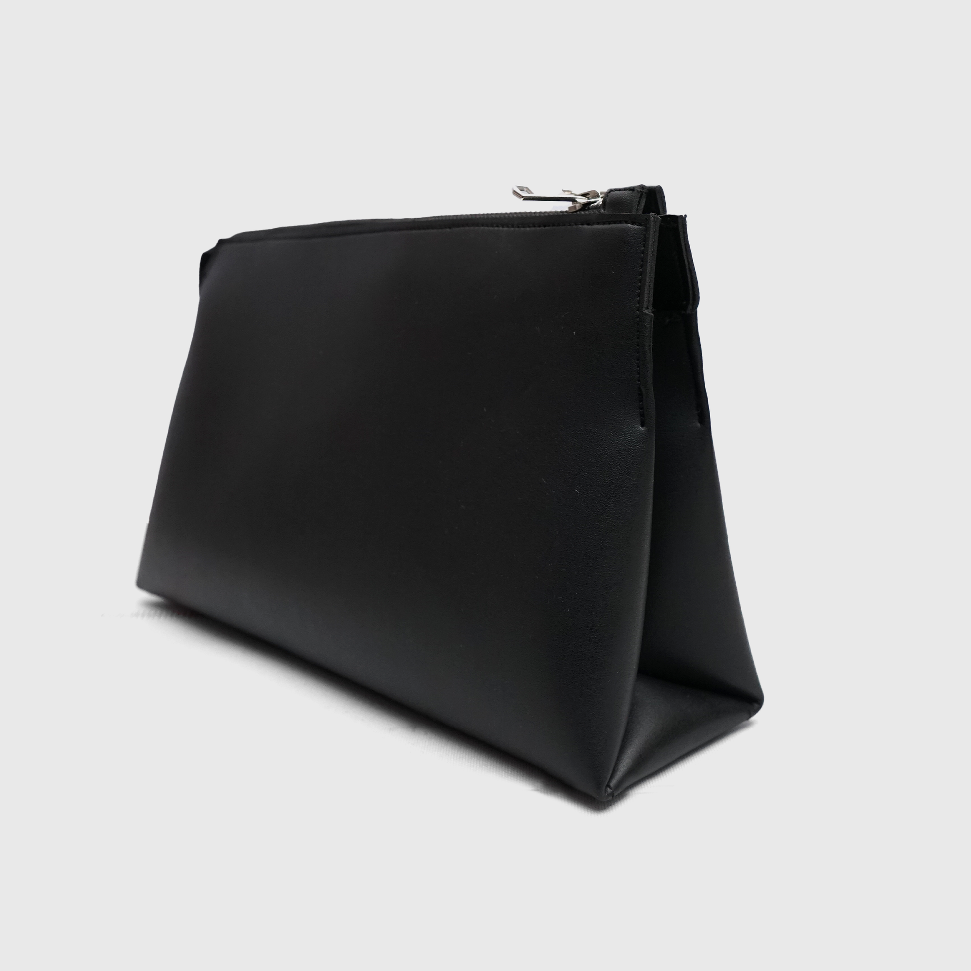 Elegant black rexine NOIRÉ clutch side angle with smooth zip closure