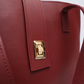 Interior compartments of maroon tote bag showing organized storage