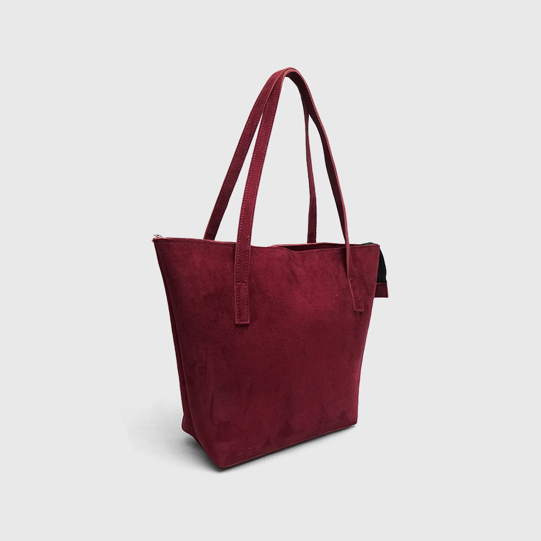 Interior organizer compartments inside maroon suede tote bag
