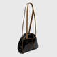 Minimal glossy black patent handbag with structured design