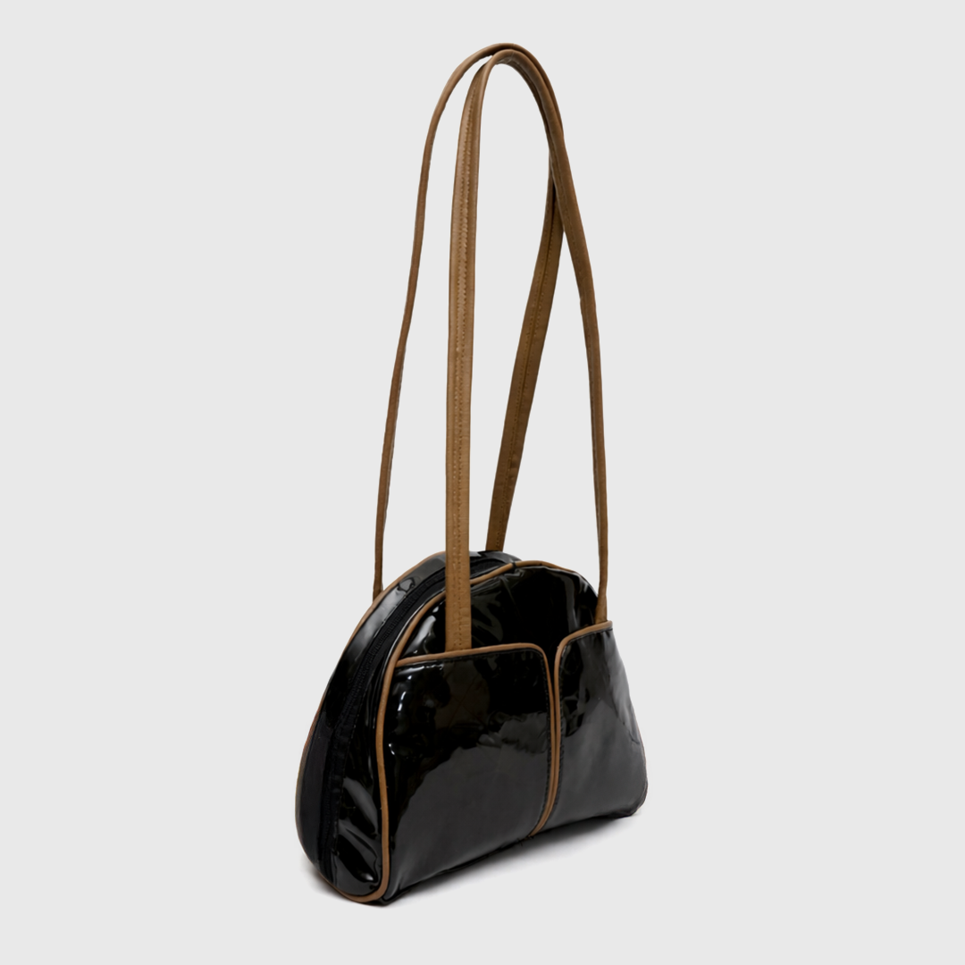 Minimal glossy black patent handbag with structured design