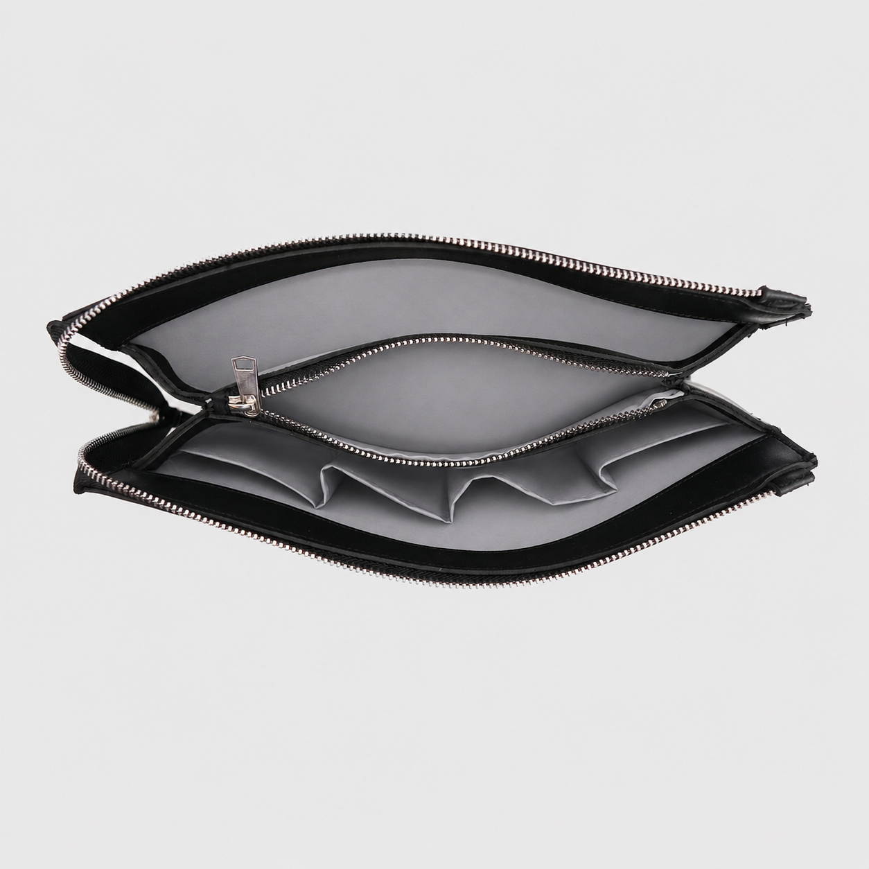 NOIRÉ minimalist black clutch close-up with premium texture and clean detailing
