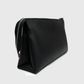 Premium NOIRÉ black clutch showcasing spacious structured design