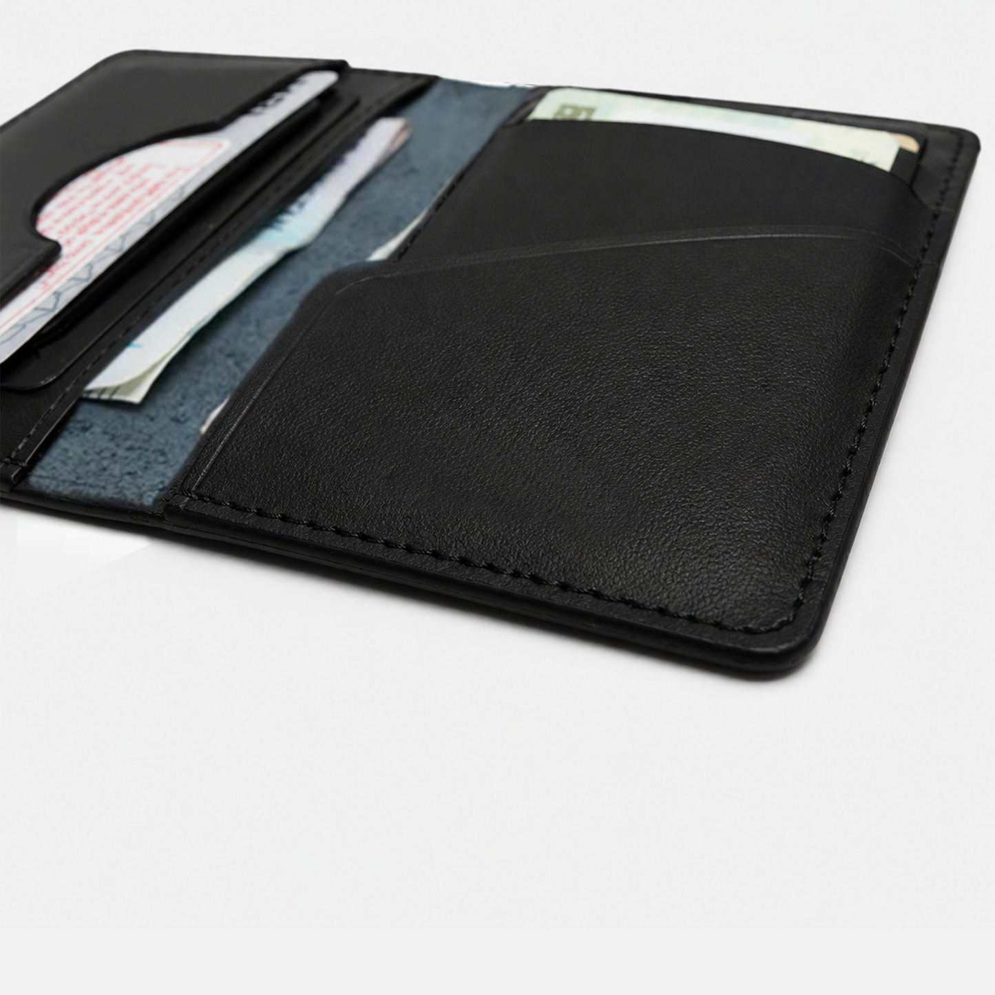 Premium black leather wallet featuring compact bi fold structure, smooth texture, and organized card storage for everyday carry.