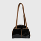 Side angle view of glossy black patent shoulder bag