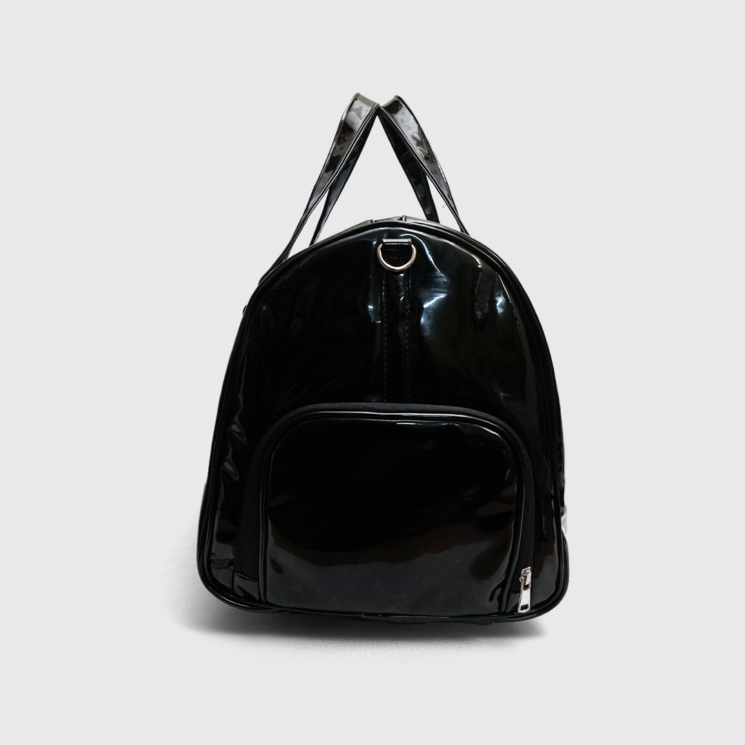 Side view of black patent leather duffle bag