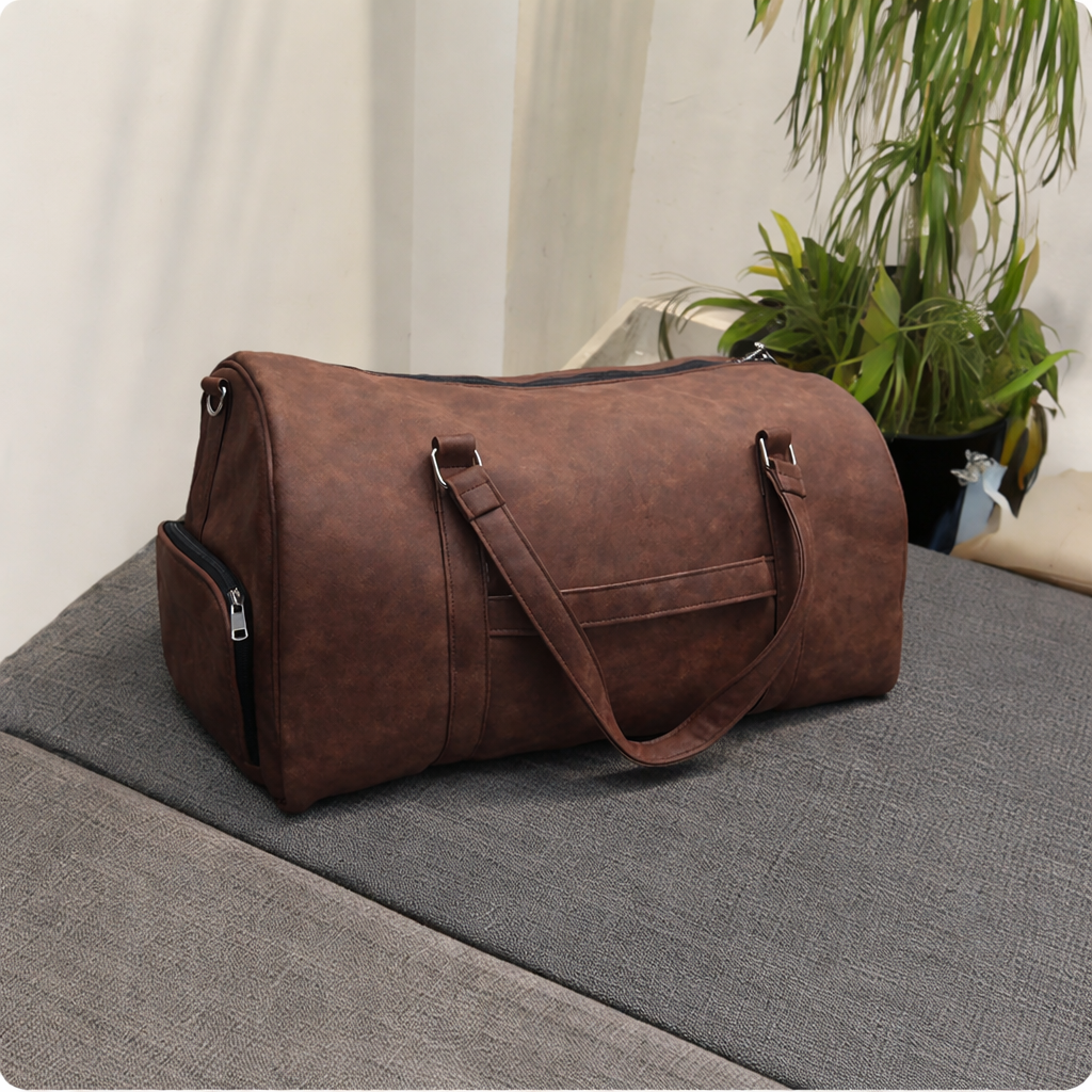 Side view of brown leather look duffle bag
