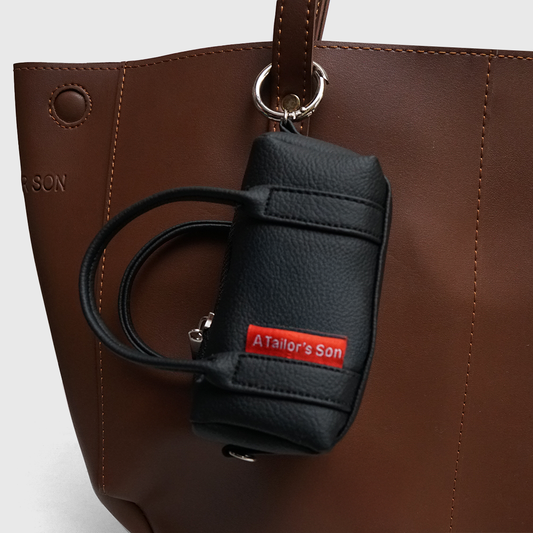 faux leather mini duffle bag charm