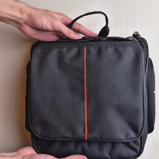 Hanging toiletry bag open with compartments and mesh pockets for organized travel essentials