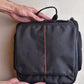 Hanging toiletry bag open with compartments and mesh pockets for organized travel essentials