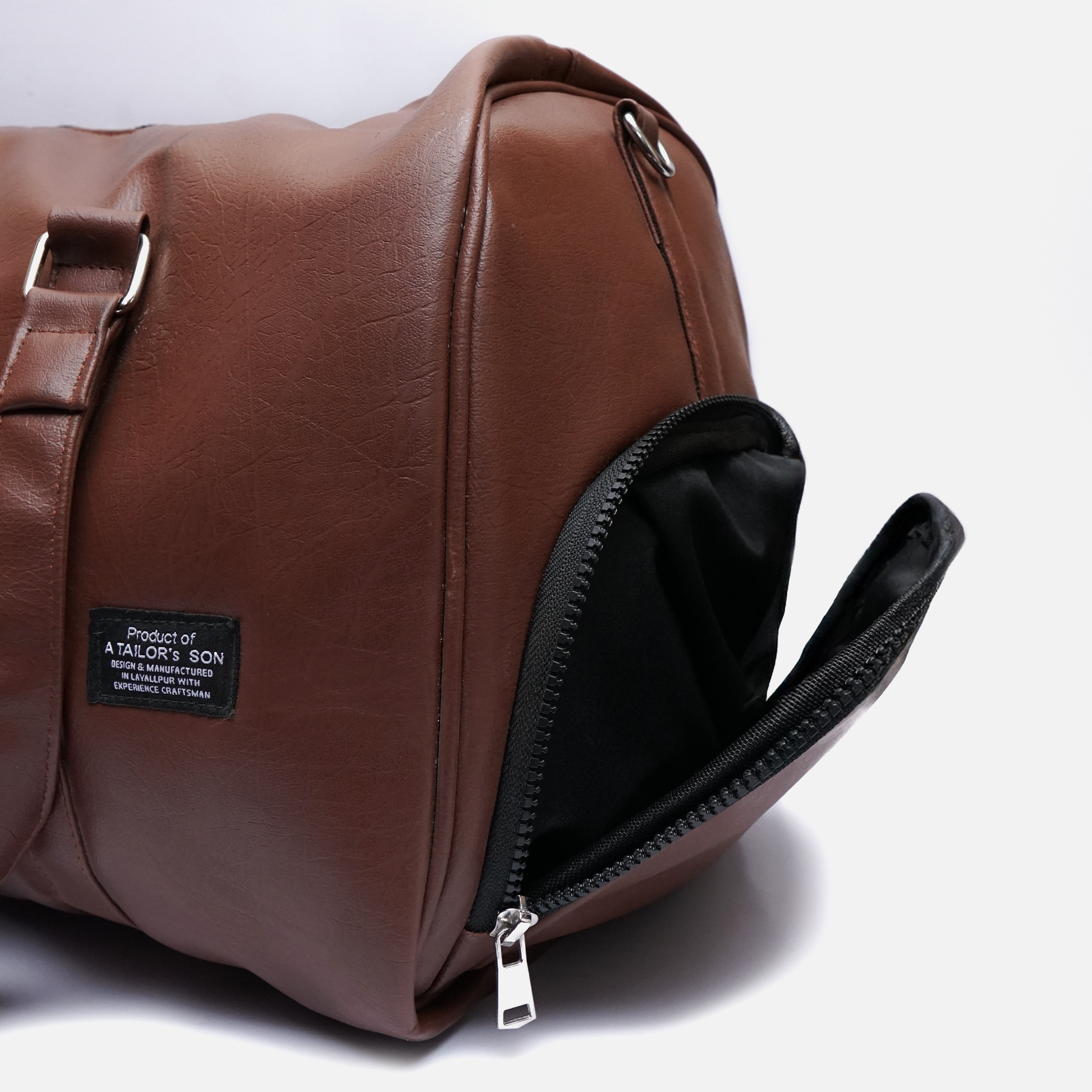 stylish brown leather travel duffle bag with soft finish and strong stitching